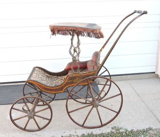 Wooden baby buggy with stenciling,