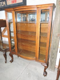 Oak china cabinet with curved glass