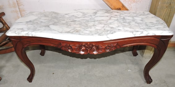 Marle top coffee table with carved