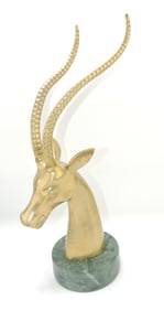 Brass antelope on marble base,