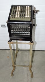 Early adding machine on stand,