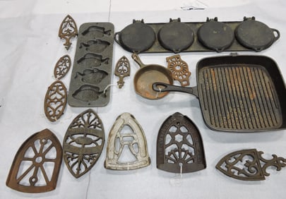 Lot of cast iron trivets and other items