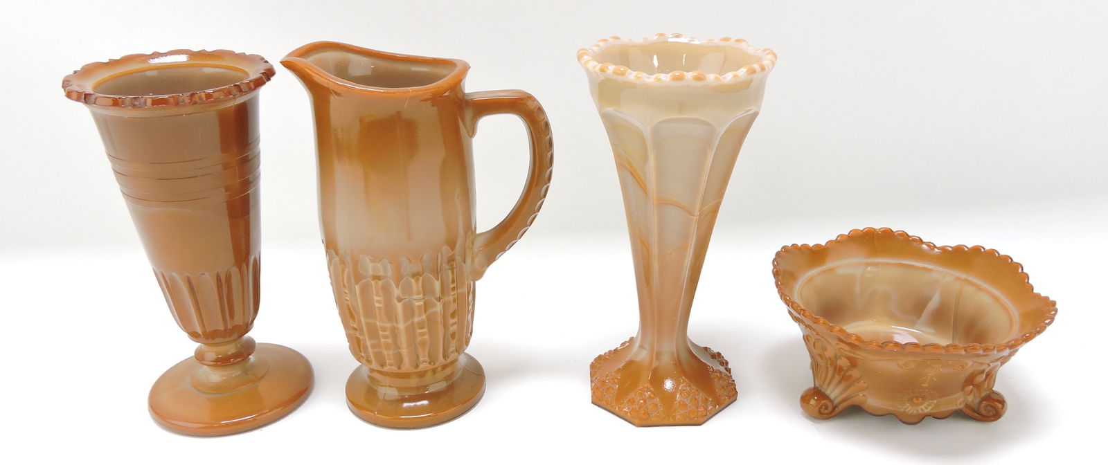 Greentown chocolate glass lot of: 4 pcs: scalloped flange vase, Stirgell creamer, beaded triangular vase, and daisy sauce dish