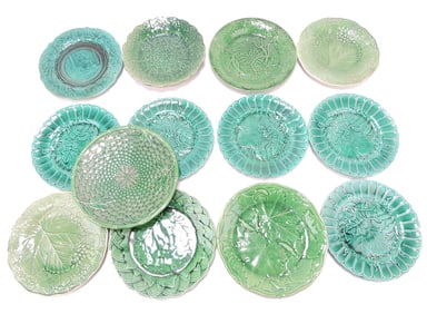Dark green majolica lot of 13 plates,