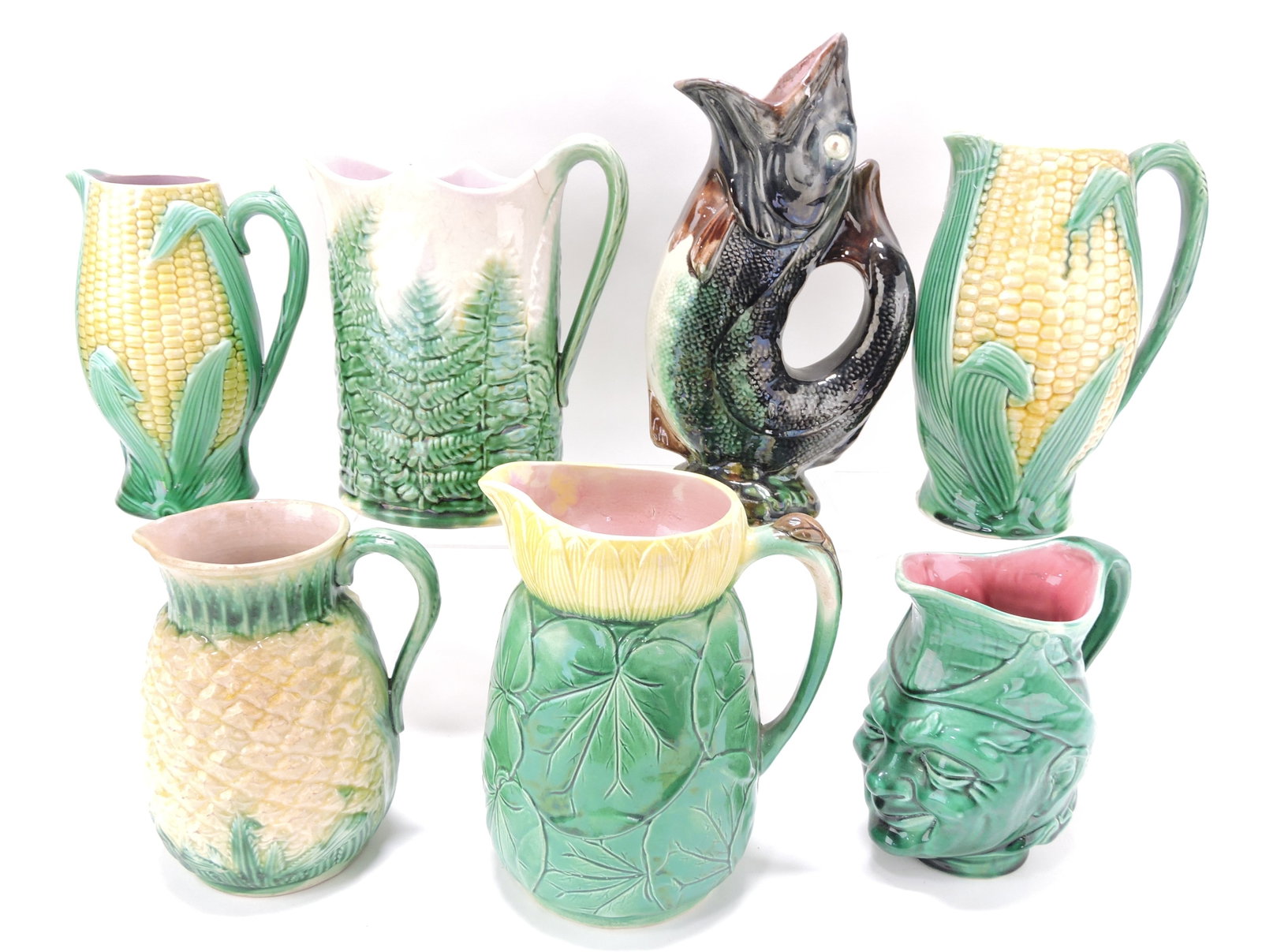 Majolica lot of 7 pitchers, 7" to 11",: various condition