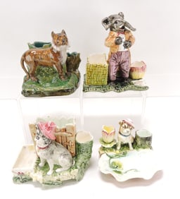 Majolica lot of 4 figural match strikers,