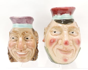 Majolica lot of 2 face jugs, 7" & 9",