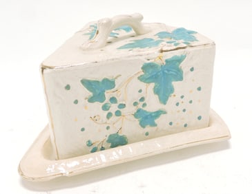 Albino majolica wedge cheese keeper,