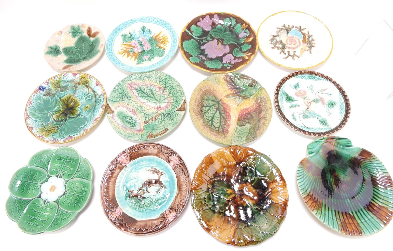 Majolica lot of 12 plates, 7" to 9",: various condition