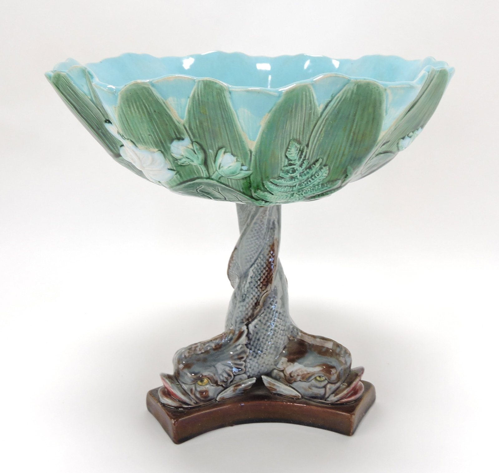 Holdcroft majolica water lily comport: supported by three dolphins, 9"h, 9"d