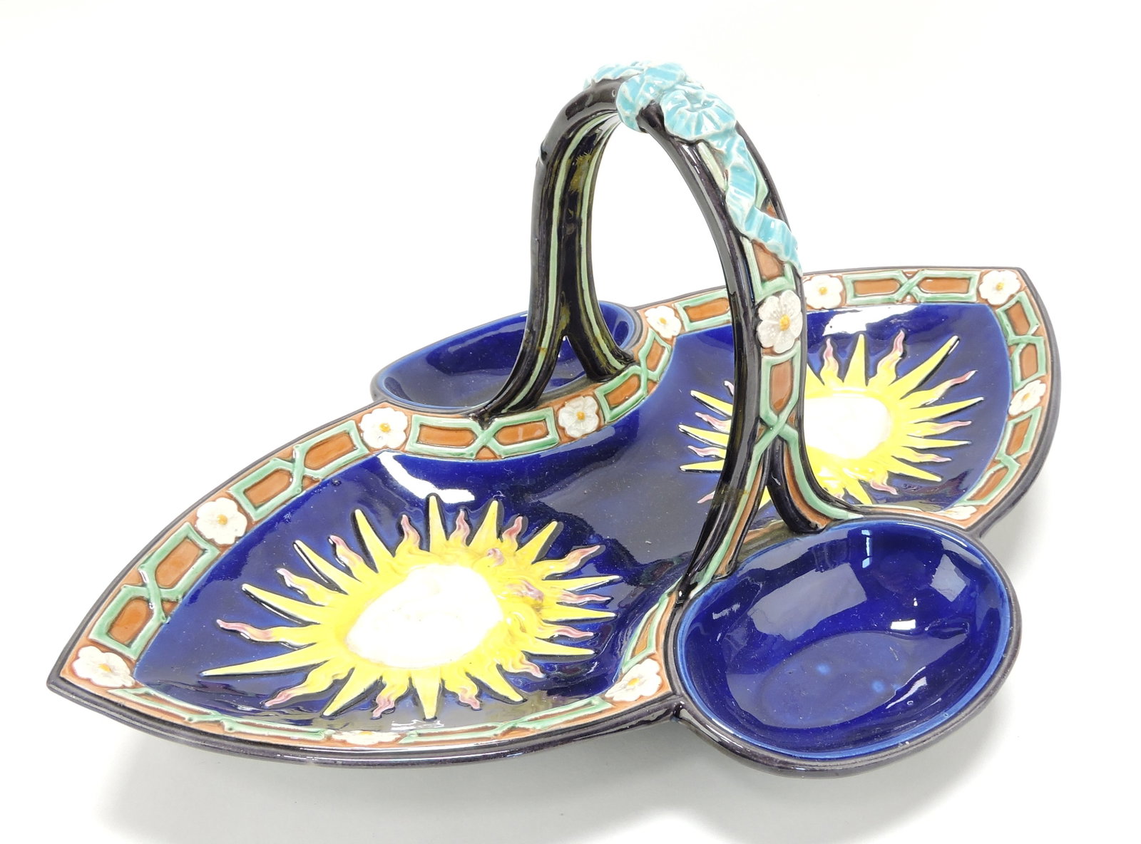 Wedgwood majolica cobalt server with: sun goddess mask, 7"h, 15"w