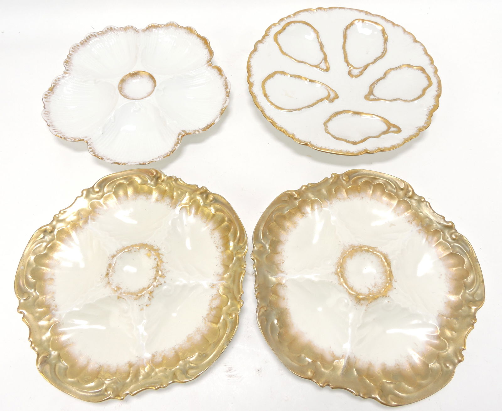 Porcelain lot of 4 oyster plates with gold (1 of 1)