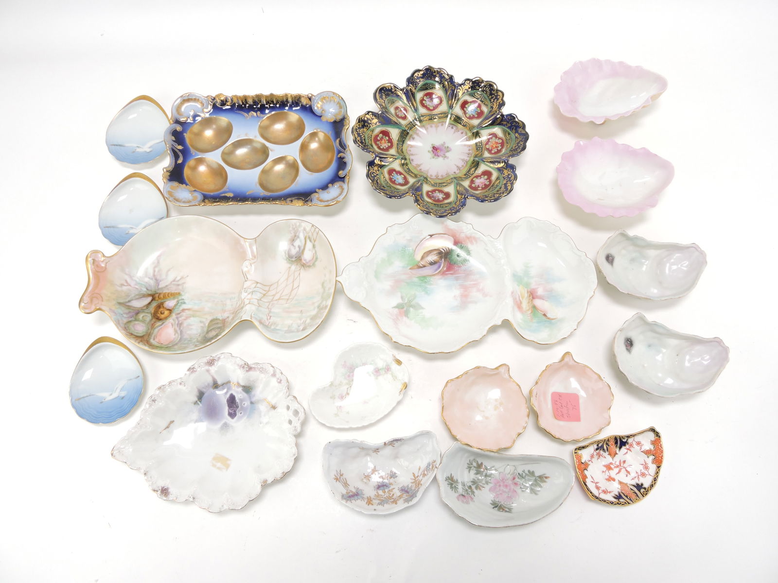 Porcelain lot of assorted oyster shooters: and seafood dishes