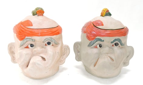 Pair of figural tobacco jars with