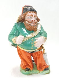 Porcelain figural tobacco jar of a