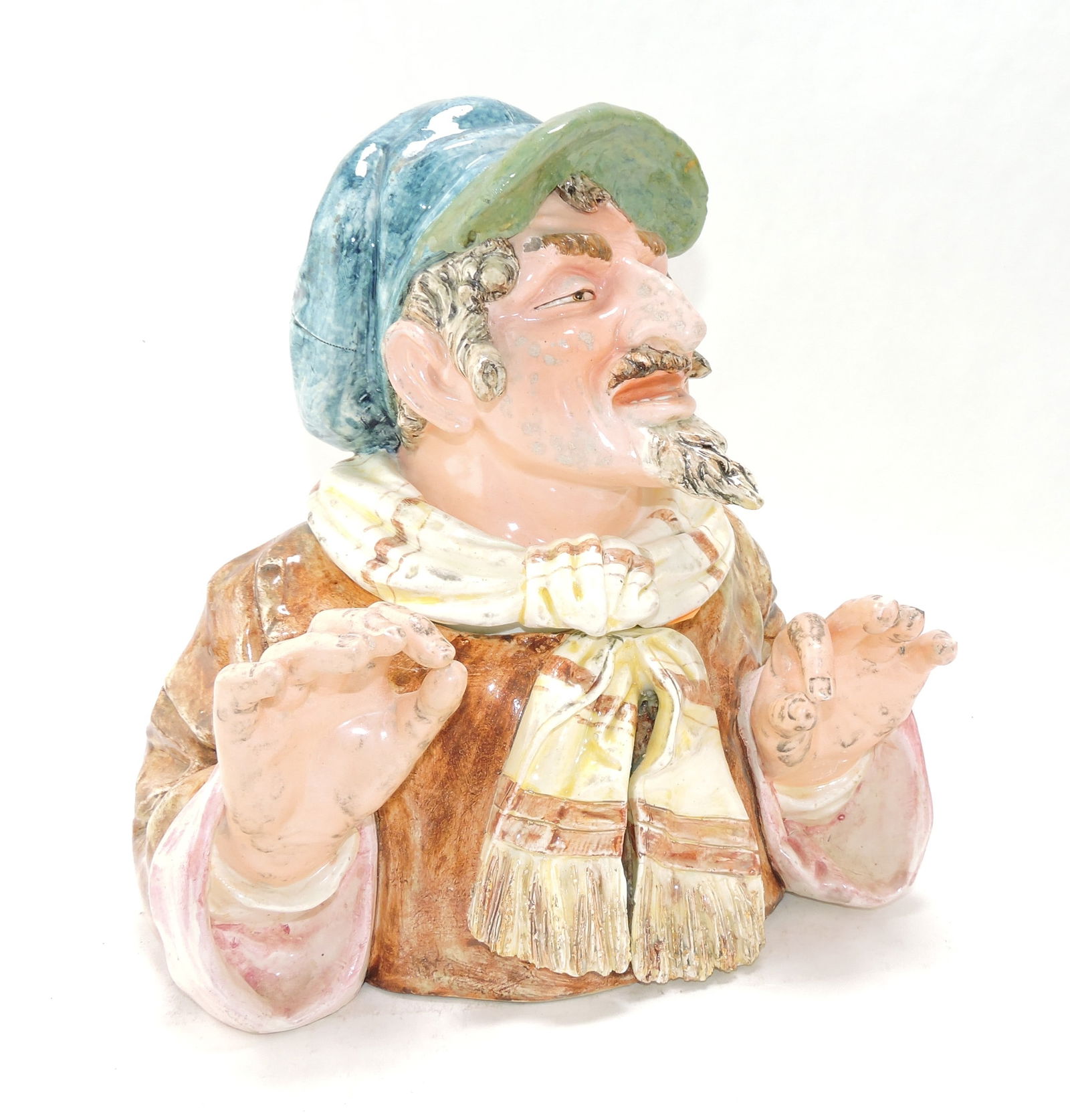 Large majolica figural tobacco jar: of a man with pointed chin, 12", repair to hat bill, ref. Figural Humidors by Horowitz #469