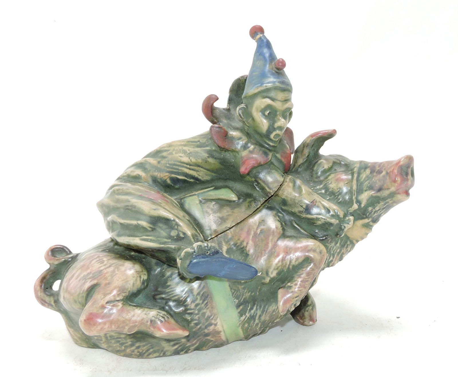 Amphora porcelain figural tobacco: jar of a clown riding a pig, tassel of clown's cap re-stuck, 7", ref. Figural Humidors by Horowitz #293