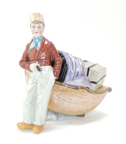 Porcelain sailor with boat figural