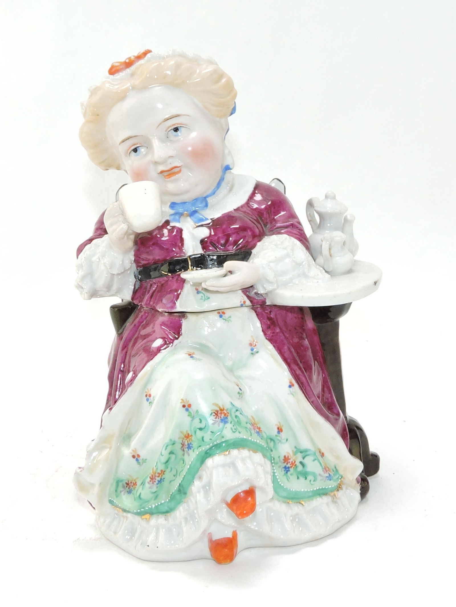Porcelain figural tobacco jar of: lady in chair having afternoon tea, 8 1/2"