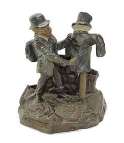 Terra cotta figural match striker with