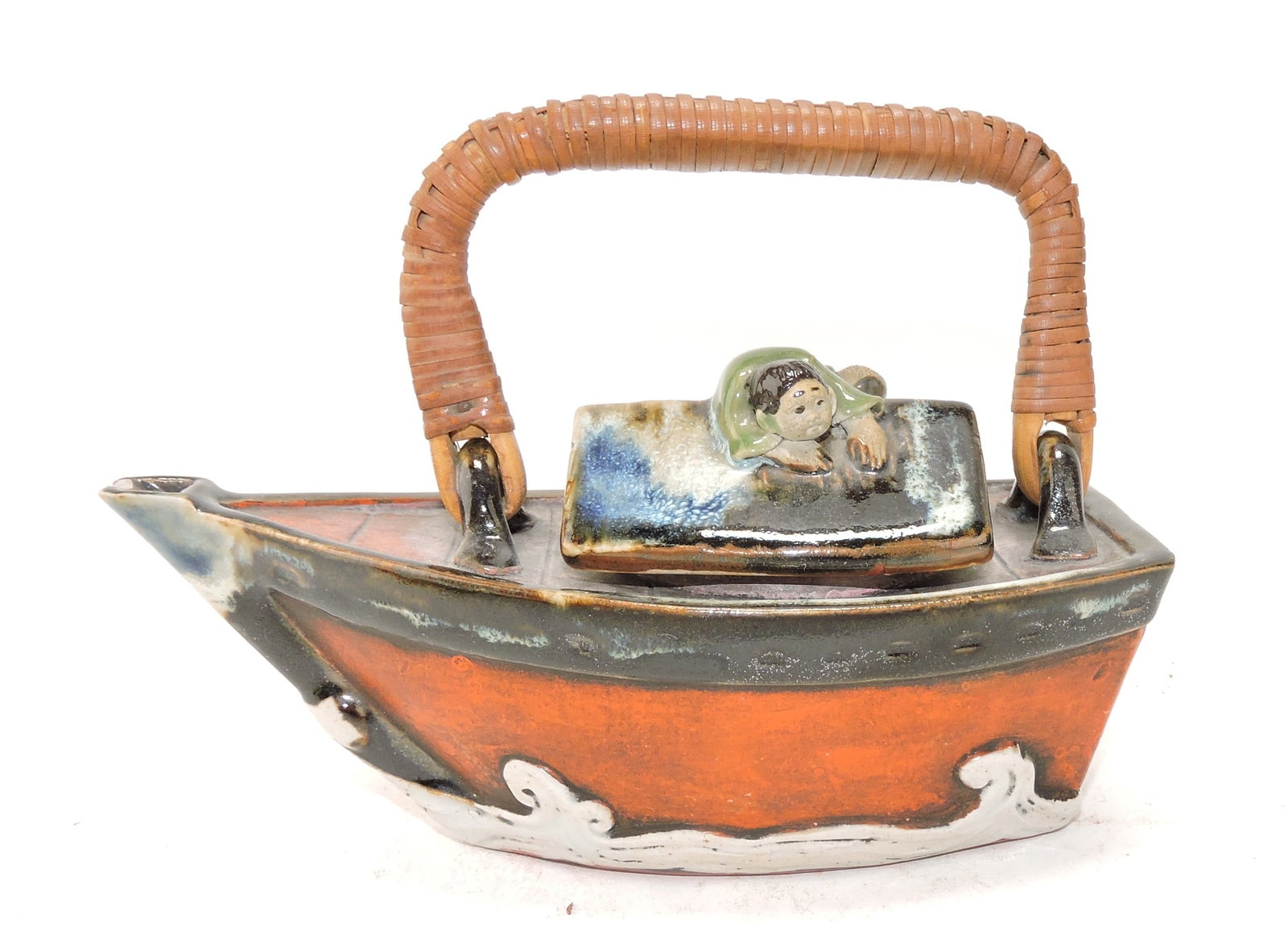 Japanese Sumida Gawa teapot in: the form of a boat, chip to spout, 3 1/2"