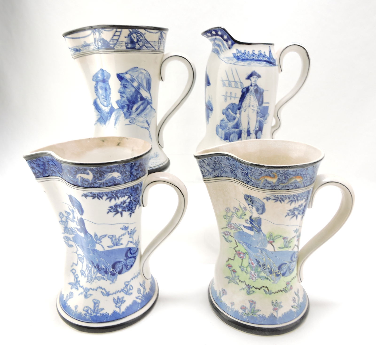 Buffalo Pottery lot of 4 blue/white: pitchers, 9"