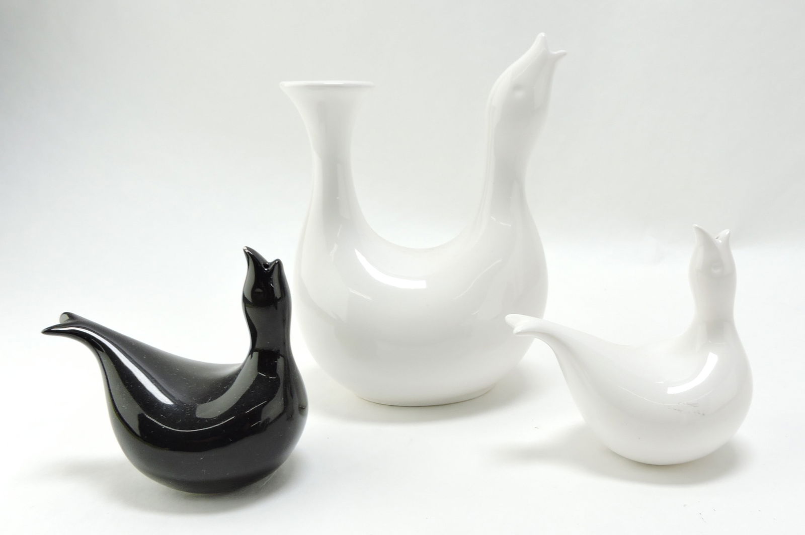 Eva Zeisel pitcher and pair of: shakers, bird form, minor nick to one shaker
