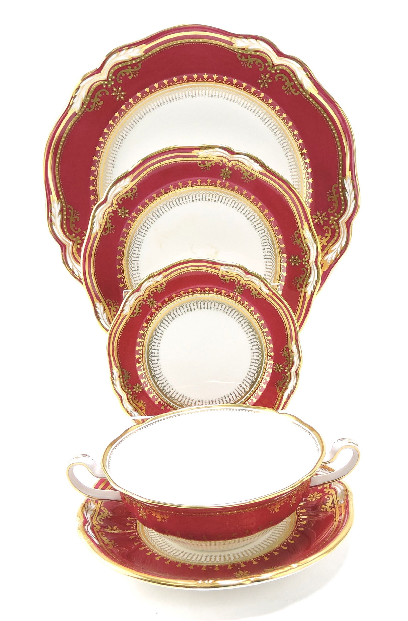 Large Spode Bone China Lancaster: crimson dinner service: 4 round covered vegetable bowls, sauce boat and stand, 2 - 13" oval platters, 12 double handled cream soups and 11 saucers; plates: 12 - 11", 12 - 7 3/4", 12 - 6"; 67 pcs