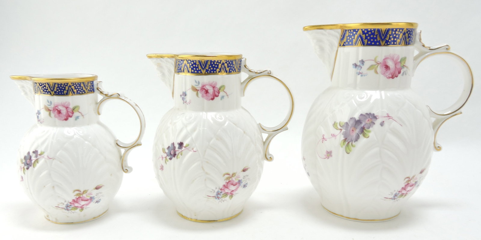 Coalport set of 3 graduated jugs,: The Caughley Mask Head Jug, 5" to 7"
