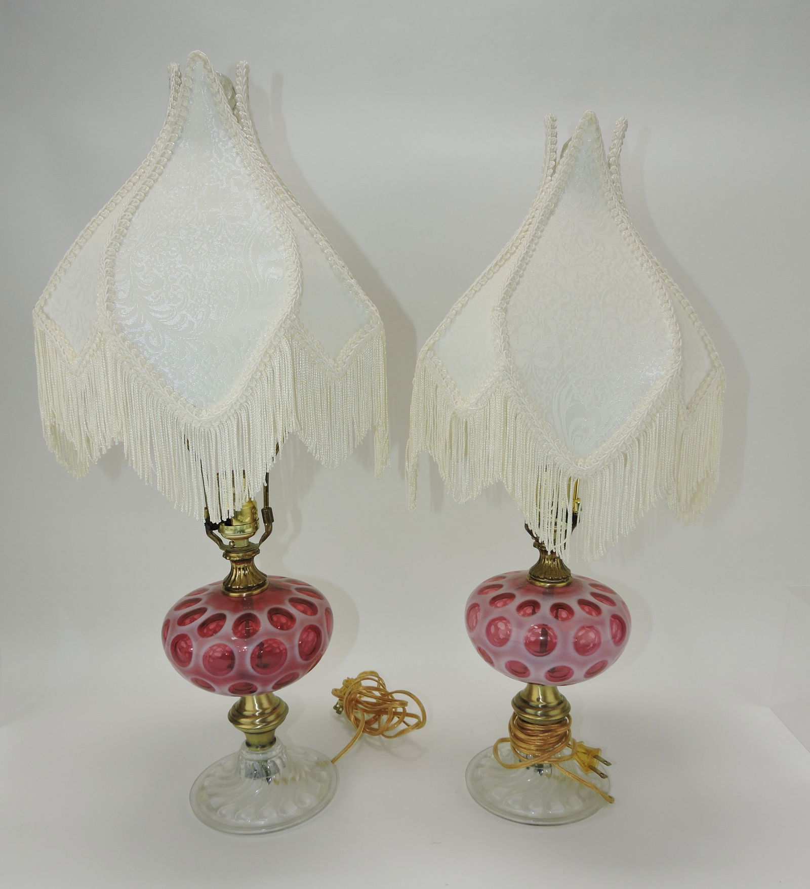 Fenton cranberry opalescent coin spot: pair of dresser lamps, 23"