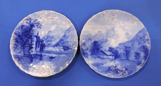 Pair of blue/white scenic plates,
