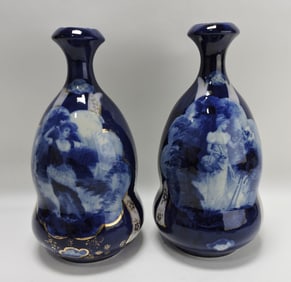 Pair of flow blue vases with ladies,
