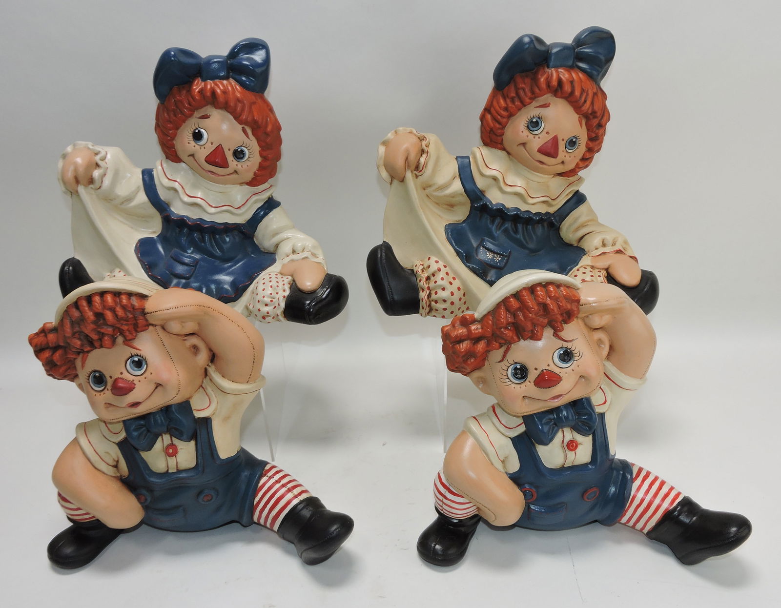 Two pair of ceramic Raggedy Ann and: Andy figures, 10"