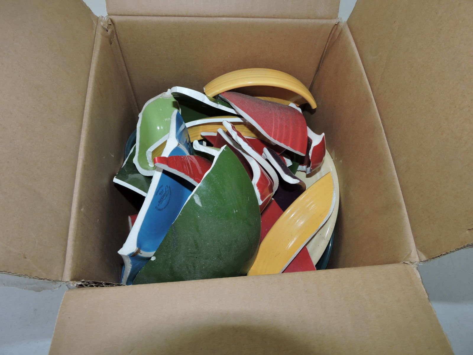 Box of broken Fiesta to make mosaics: .