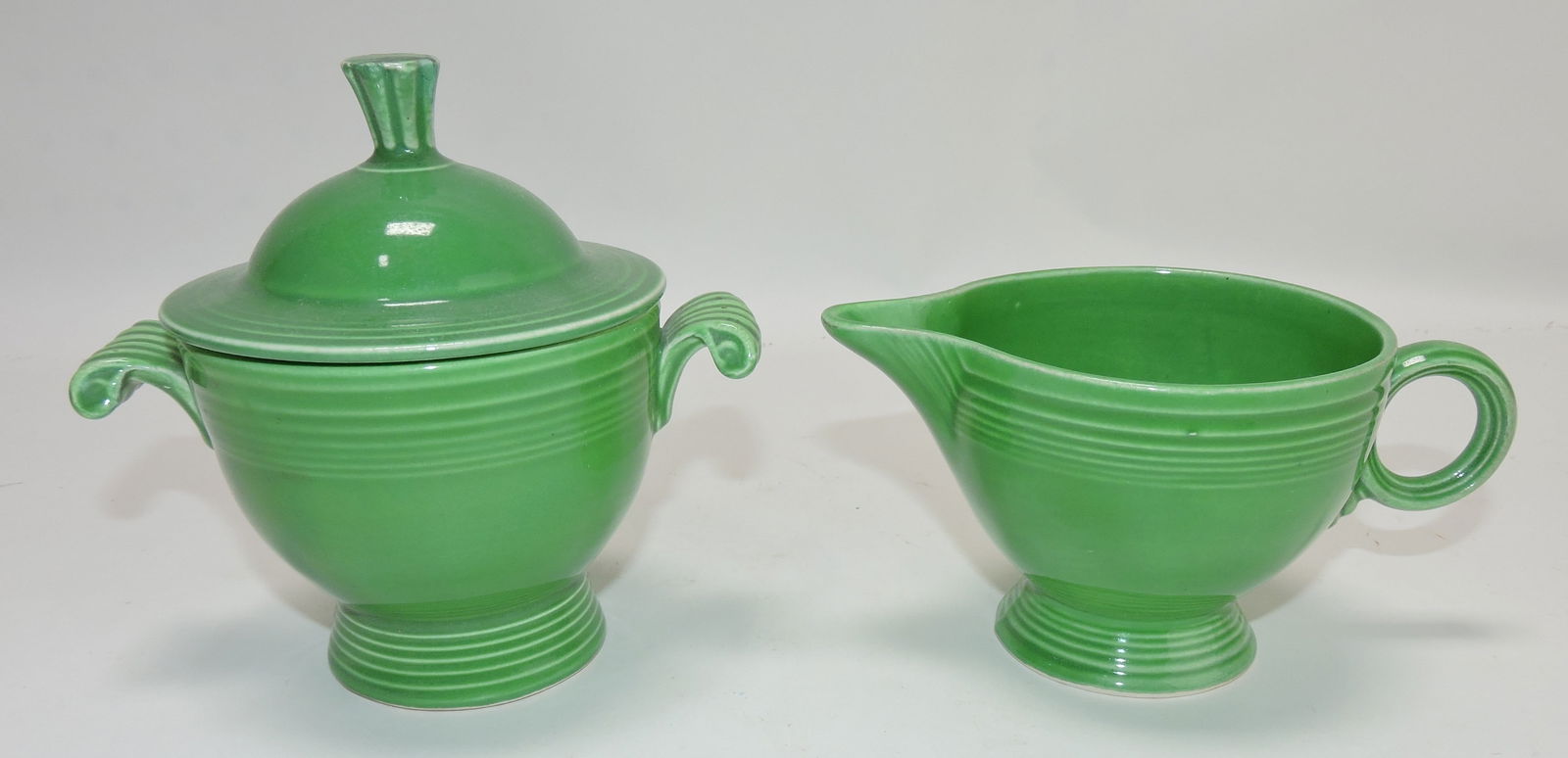 Fiesta cream & sugar, medium green,: chip to finial