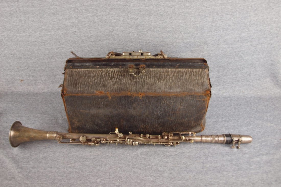 Geo. M. Bundy, Paris nickel over brass clarinet with: Geo. M. Bundy, Paris nickel over brass clarinet with carrying case with many accessories