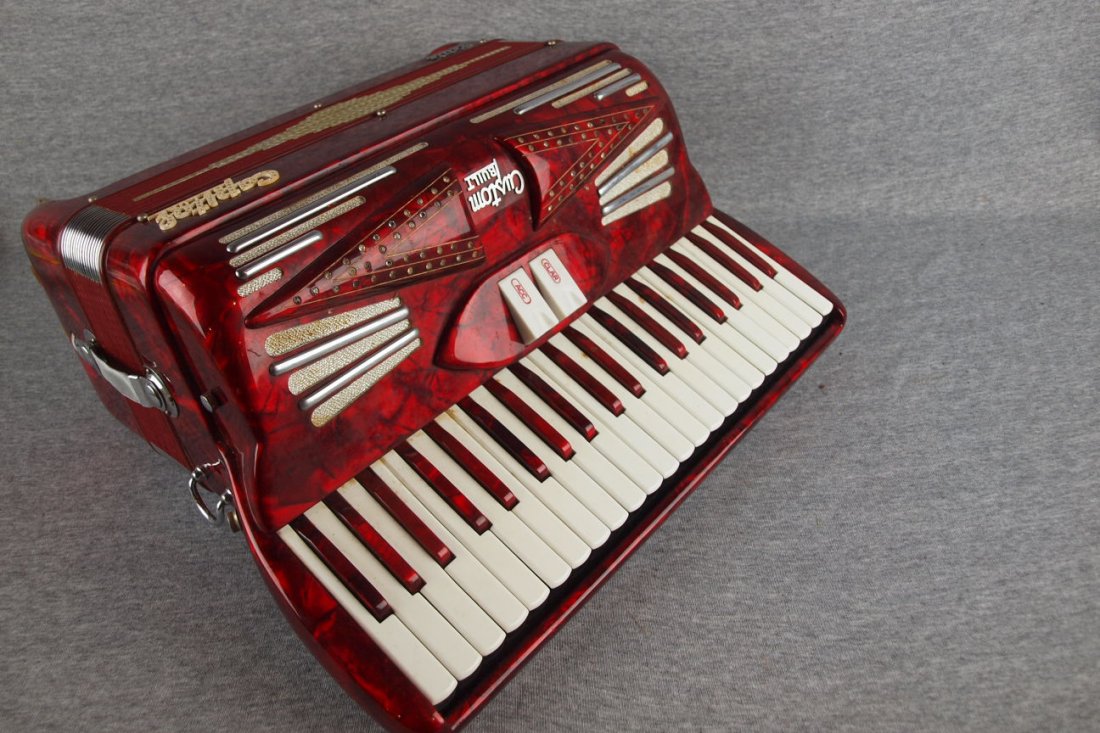 Capitol Deluxe Petite Custom Built red metalic accor: Capitol Deluxe Petite Custom Built red metalic accordian with case, made in Italy, No. 19670