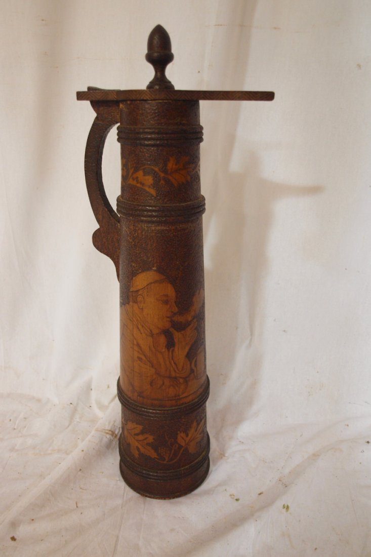 Burnt wood art wooden stein with monks, one drinking: Burnt wood art wooden stein with monks, one drinking from a stein and the other smoking a pipe, signed "Dru Shepherd 1903", 24"