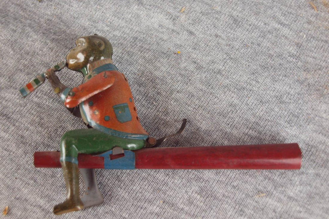 German tin lithograph penny toy, "Monkey Whistle" : German tin lithograph penny toy, "Monkey Whistle"