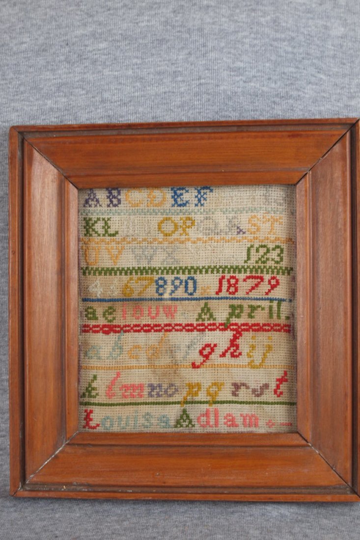 Early framed sampler "Louisa Adlam 1879" with letter: Early framed sampler "Louisa Adlam 1879" with letters and numbers, 7" x 8"