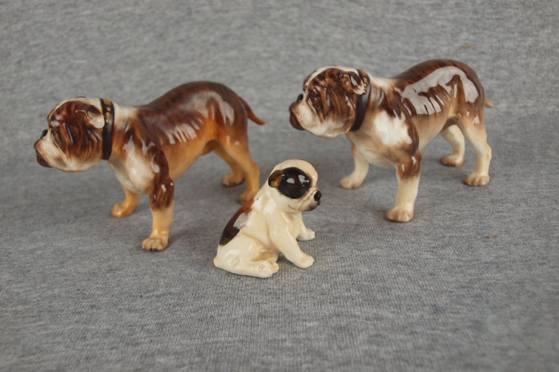 Royal Doulton lot of 3 bulldogs, crack/repair to one