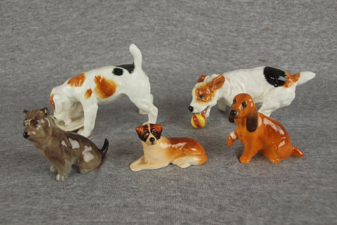 Royal Doulton lot of 5 dog figures, repair to dog wi