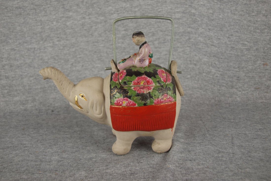 Japanese Banko ware figural teapot of an elephant wi