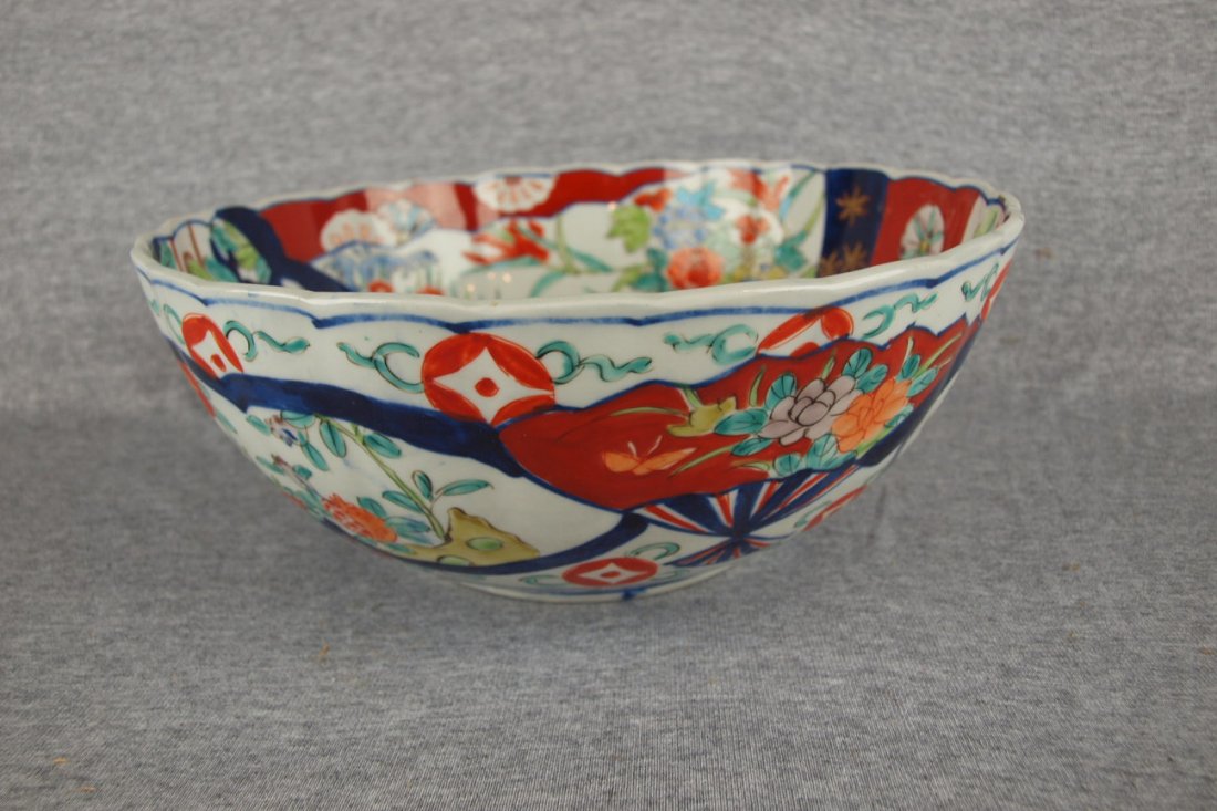 Imari large bowl with various scenes, 11 1/4"d, hair