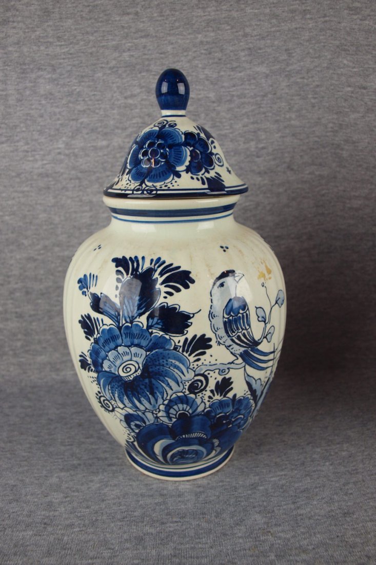 Delft blue and white floral covered urn with bird