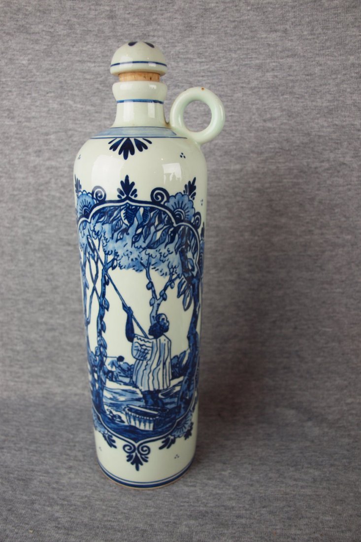 Delft blue and white wine jug with floral motif, 12"