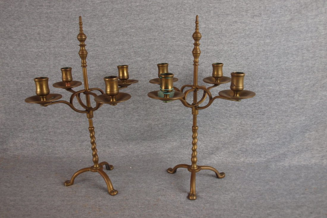 Pair of early brass 4 lite candle holders with paw f