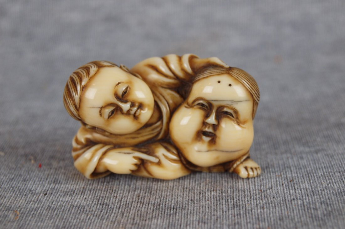 Early antique ivory netsuke of Oriental man with mask: Early antique ivory netsuke of Oriental man with mask, 2"l