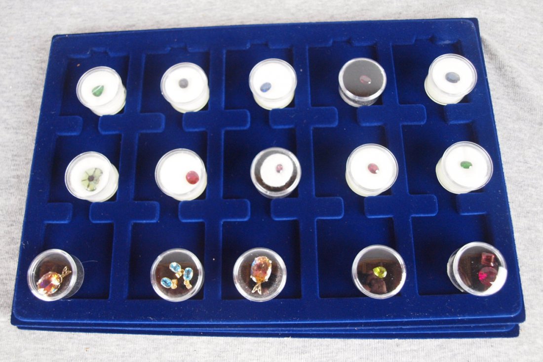 Lot of 18 gem stones - 2.76ct Tsavorite garnet, 6.87: Lot of 18 gem stones - 2.76ct Tsavorite garnet, 6.87ct Transpechite, rainbow topaz pendant silver mount, topaz pendant with 14kt mount, 3 blue topaz pendants with 14kt mounts, 3.54ct ruby doublet, 2.6