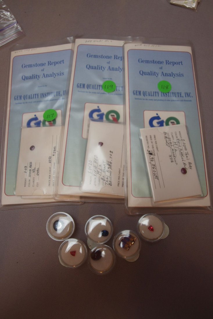 Lot of 9 assorted gemstones: Lot of 9 assorted gemstones - 2.35ct blue sapphire, 9ct 13mm black diamond, 1.03ct oval red ruby, 1.04ct heart cut red ruby, 2.03ct oval red ruby, 1.25ct orange sapphire, 2 Ametrine emerald cut stones